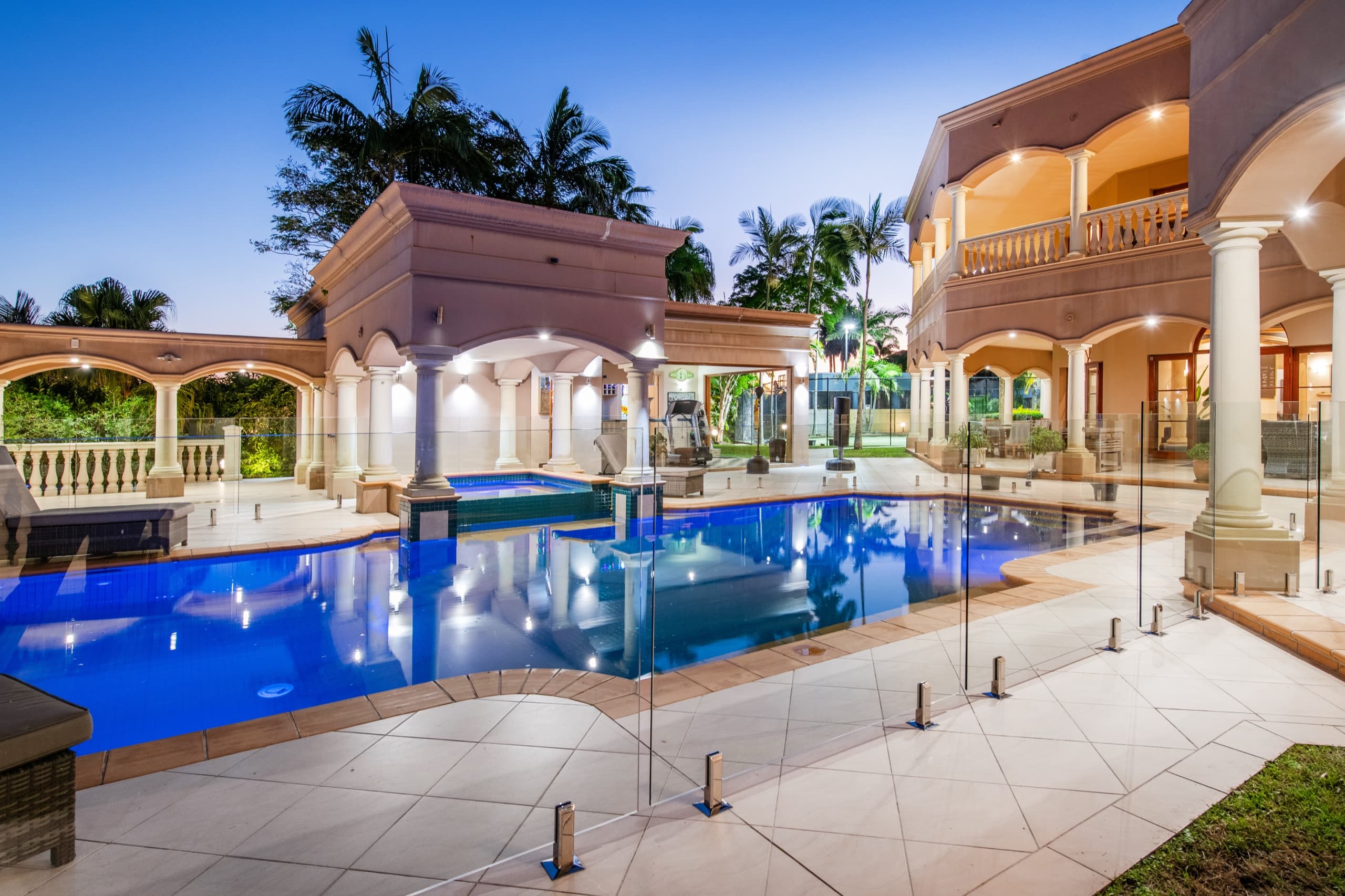 Resort-style pool with sun loungers overlooking the marina